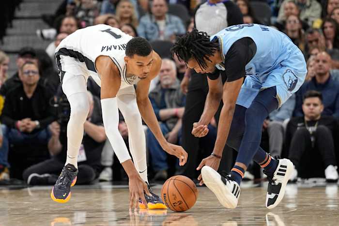 Nov 18, 2023; San Antonio, Texas, USA; Memphis Grizzlies forward Ziaire Williams (8) and San Antonio Spurs forward Victor Wembanyama (1) battle for a loose ball during the second half at Frost Bank Center.